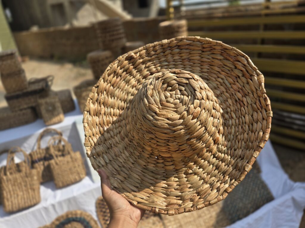 Hats and Bags on display at a stall near Chilika lake, all made of invasive water hyacinth 